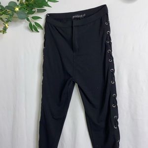 Black jeggings with the lace up on the sides.